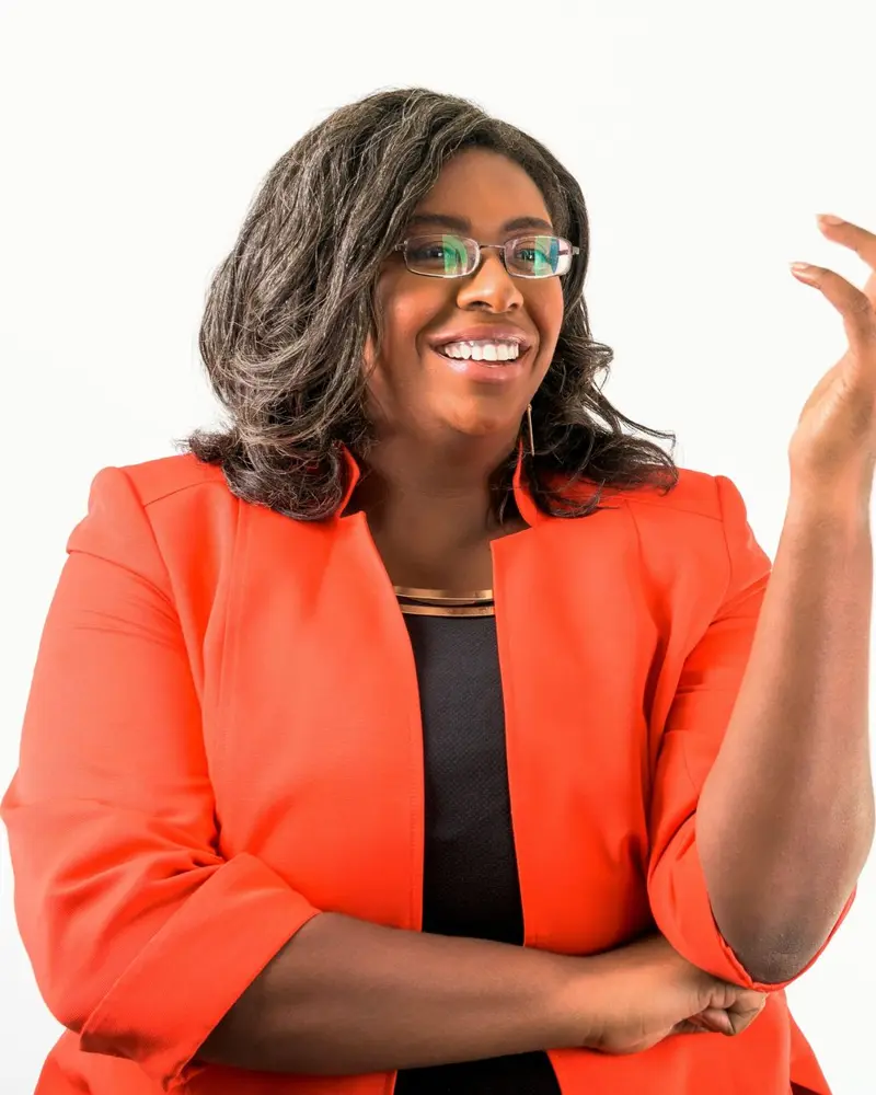 Dr. LaToya René Robertson speaking, smiling and gesturing